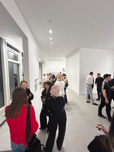 Entrepreneurs engaging in a lively discussion during a Bizz Buzz networking event.