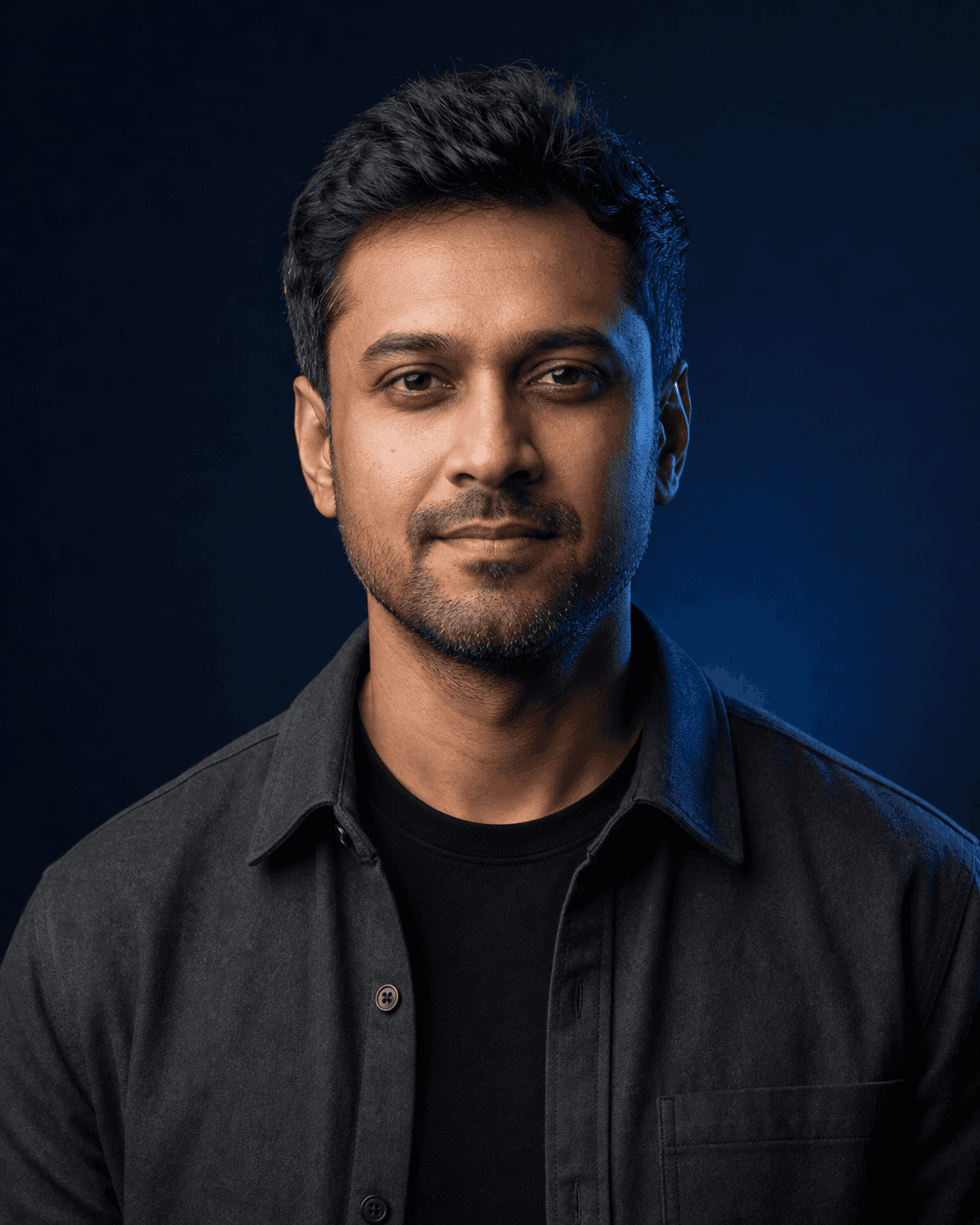 Editorial studio portrait of Arjun Mehta, Automation Lead