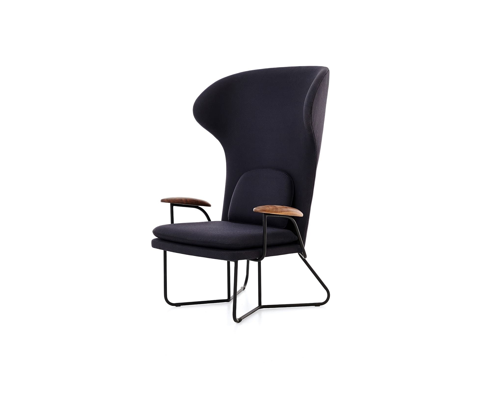 Tall black high-back wing chair with wooden armrests, presented in a minimalist gallery style.
