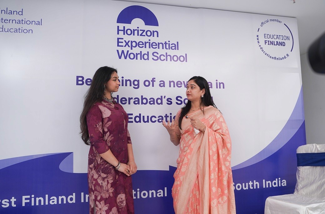 A school building stands against the backdrop of a clear sky