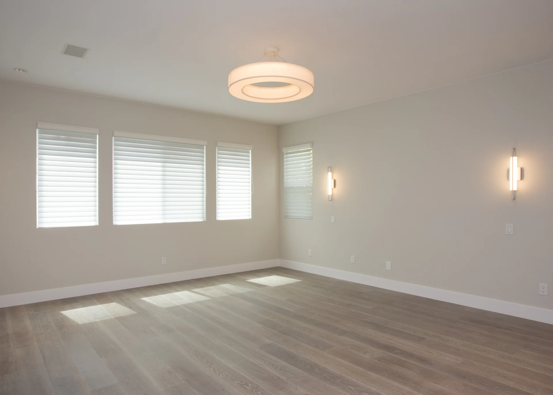 Full view from angle 2 of the master bedroom, highlighting the seamless integration of contemporary style and comfort in the Harbor Cove remodel.