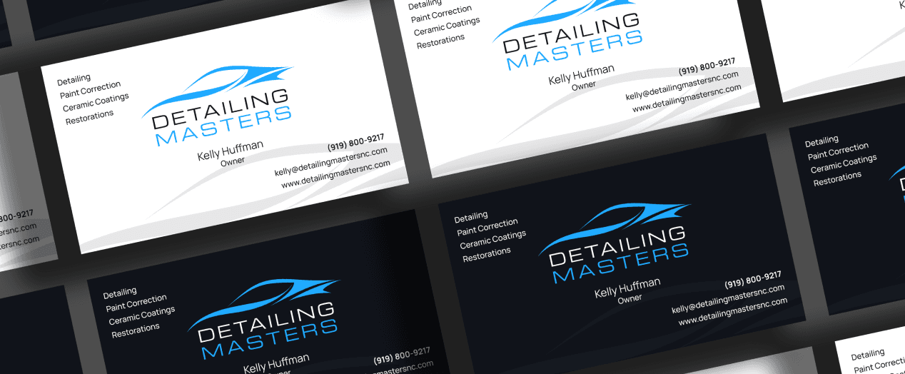 Close up photo of a grid of business cards in dark mode and light mode featuring Detailing Masters new brand on the cards