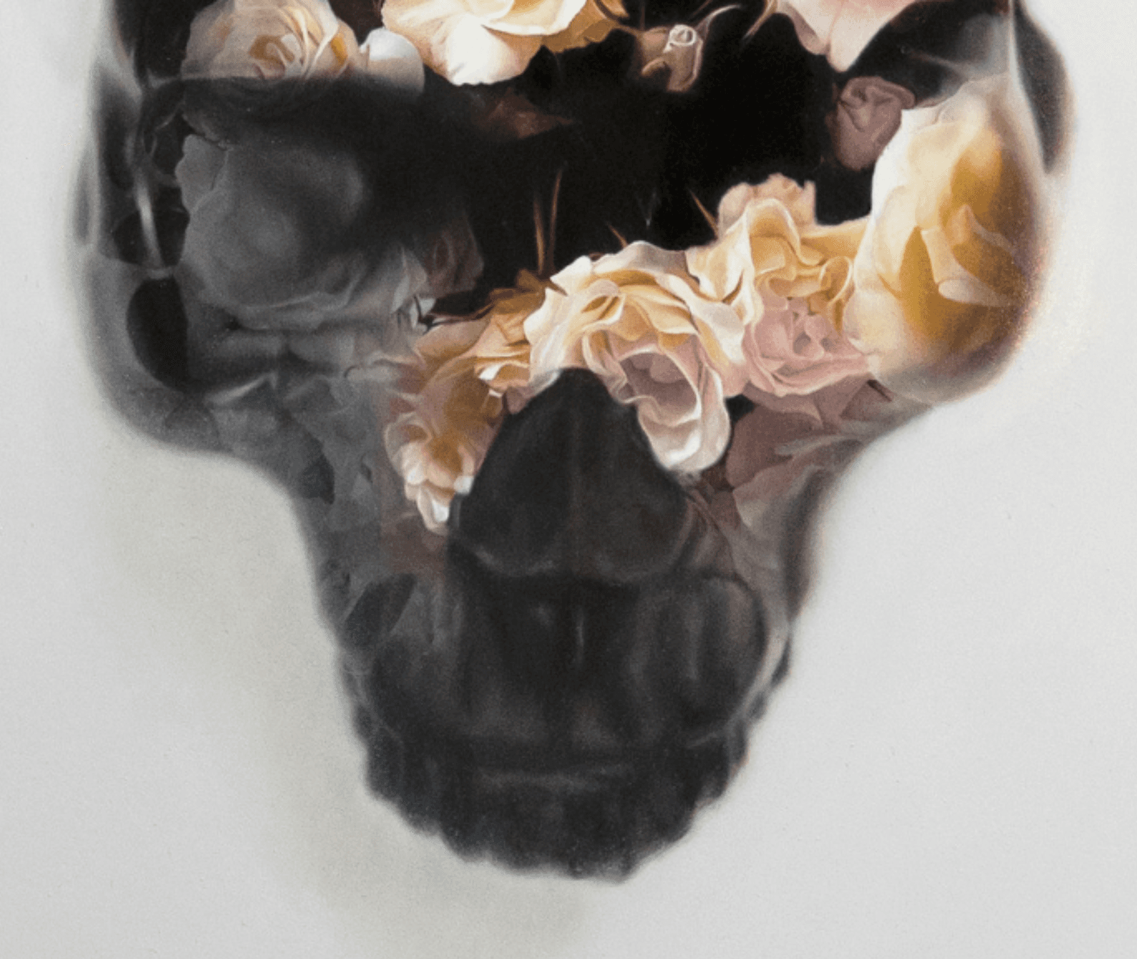 black skull painting overlayed with flowers and roses