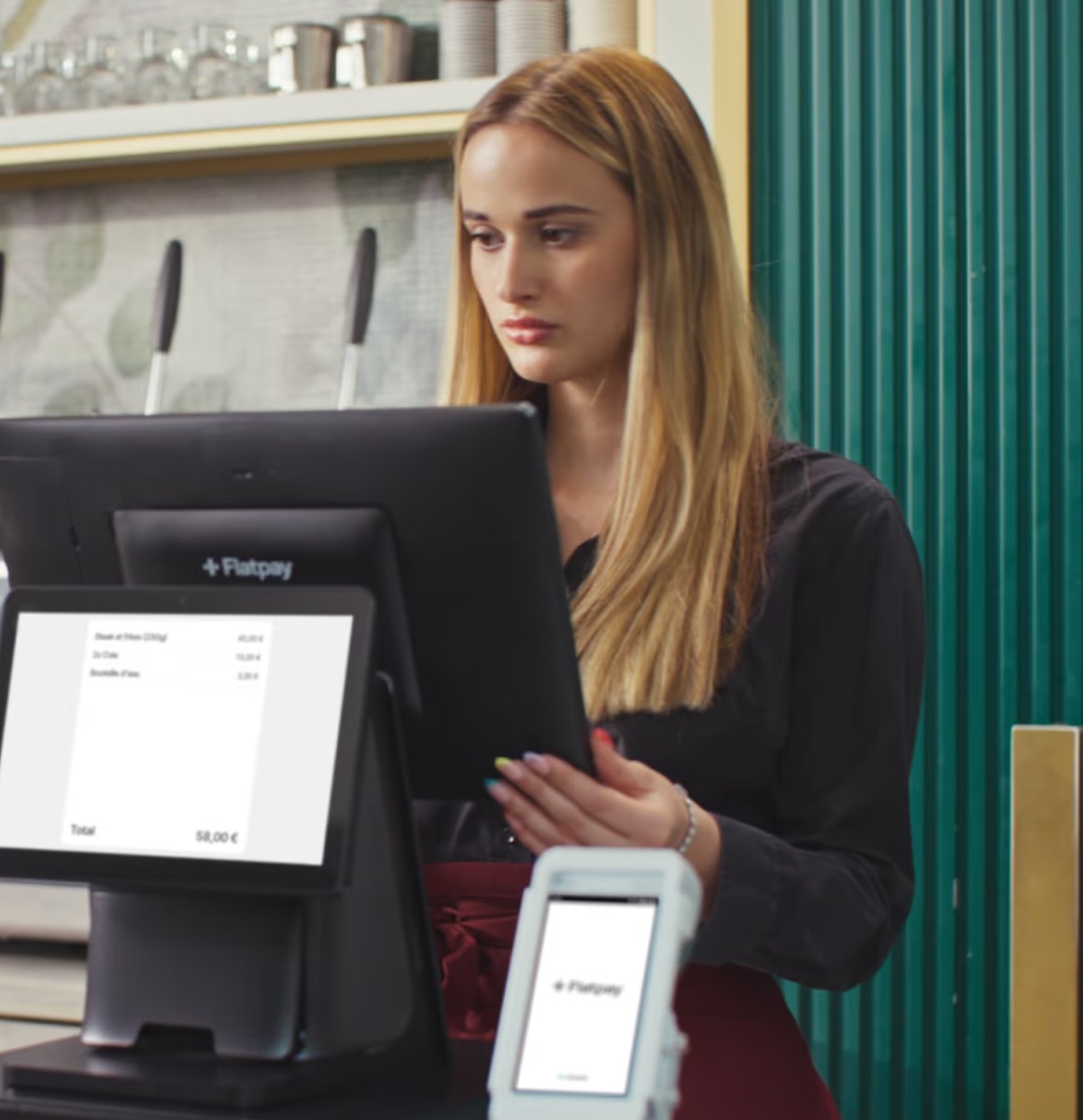 Person walking on snowy path through pine forest