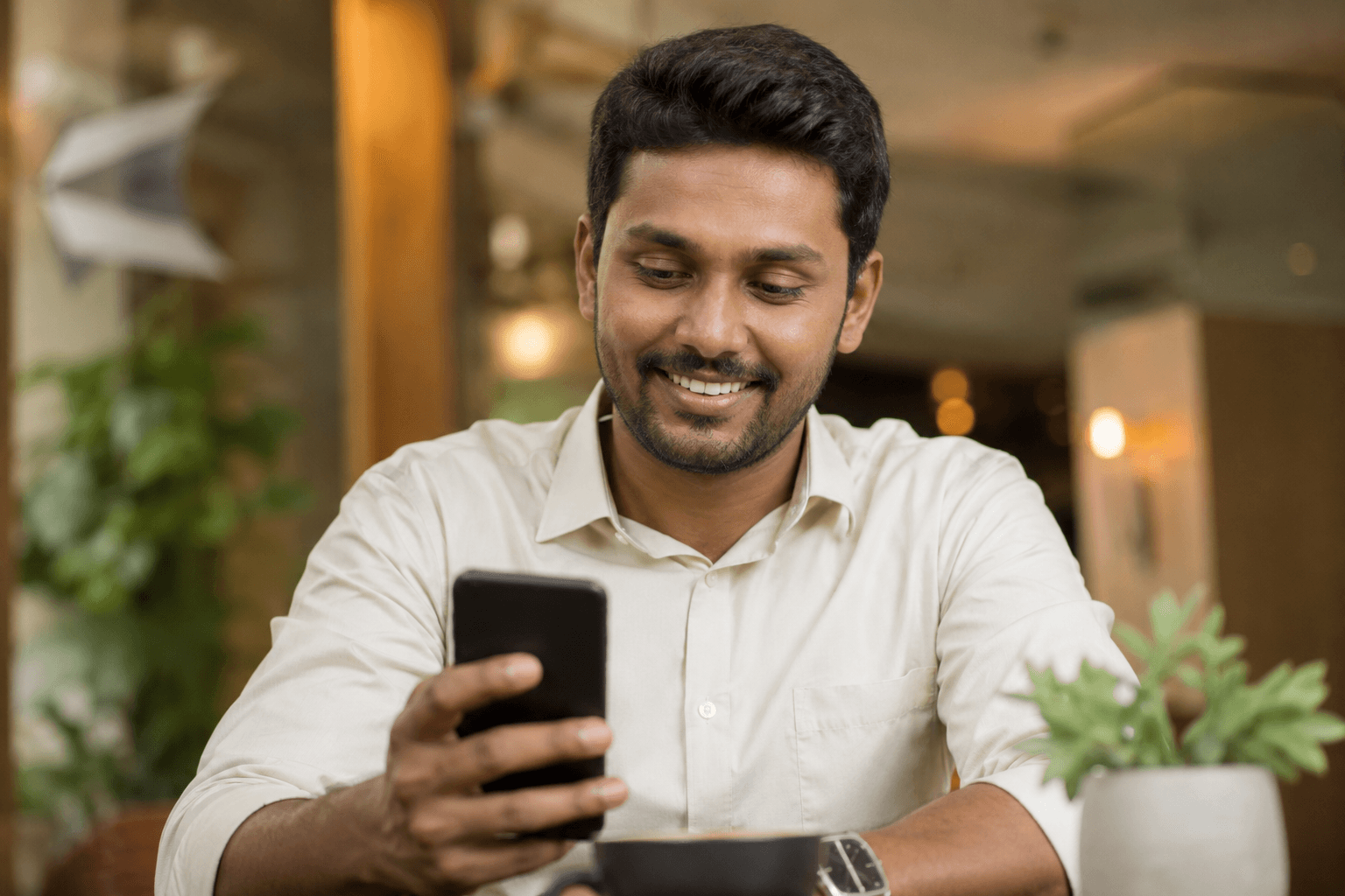 two people looking at a tablet and smiling