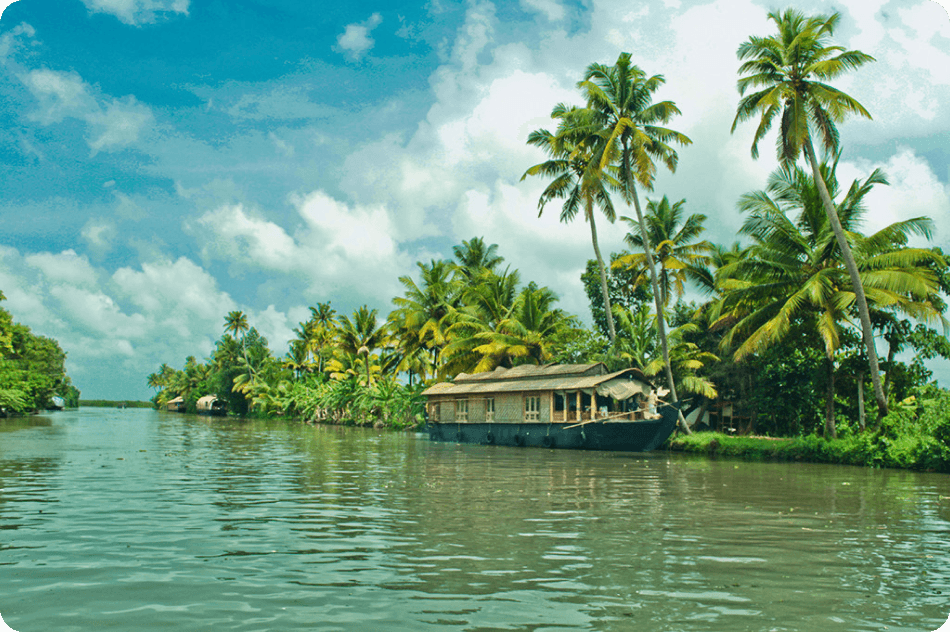 brown and white concrete building near green trees and body of water during daytime