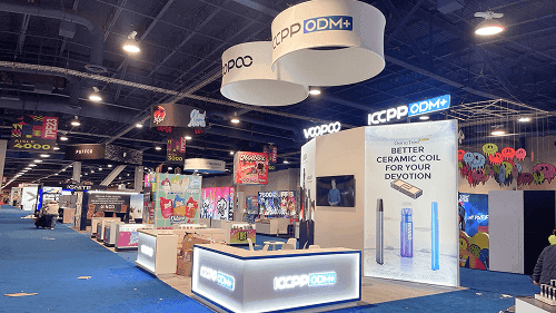 20x20 trade show booth with lightbox branding, product demo counter, hanging sign, branded graphics, and island layout