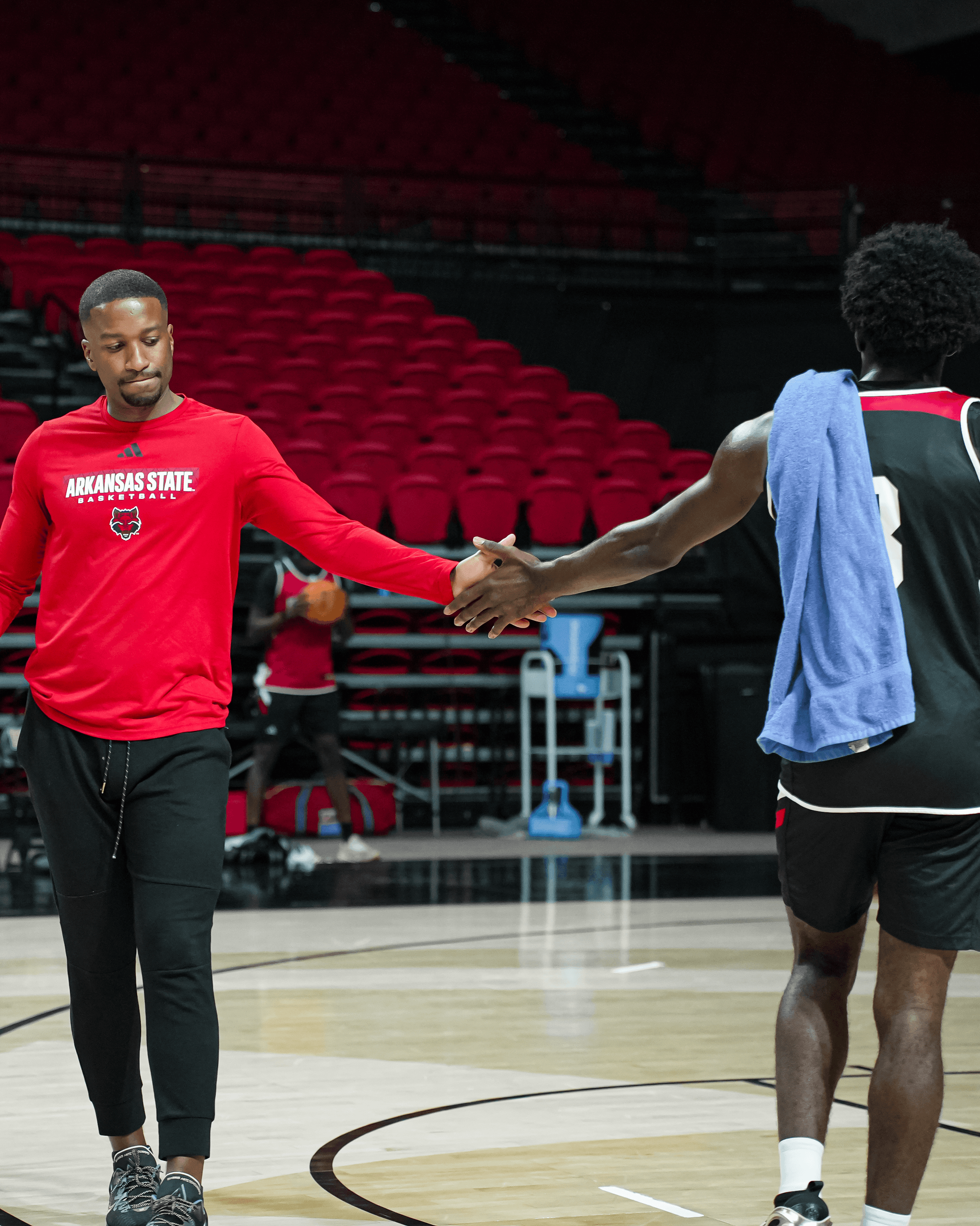 man standing beside wall