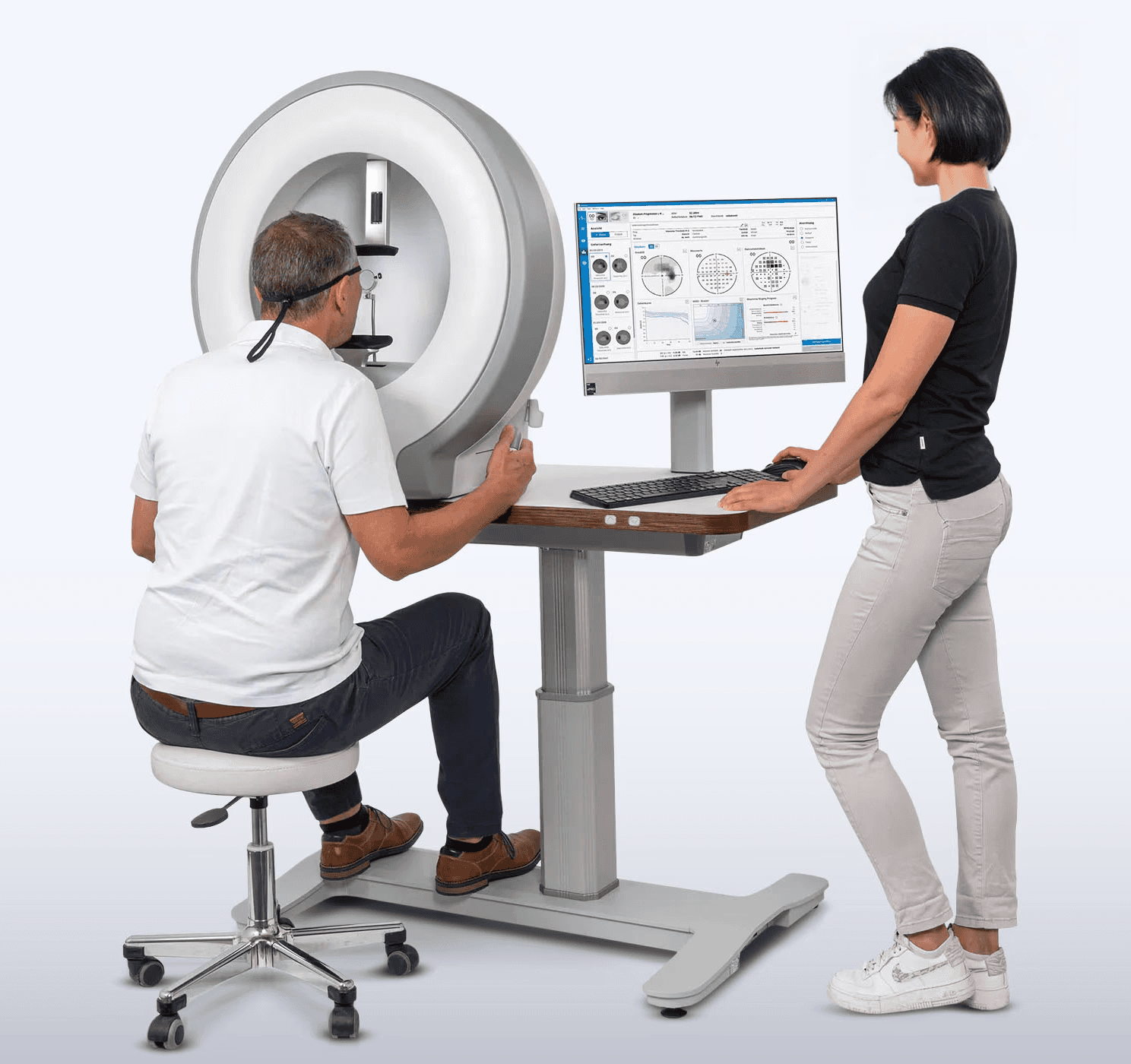 A monitor displaying the Pentacam software with a color-coded graphic of an examined eye.