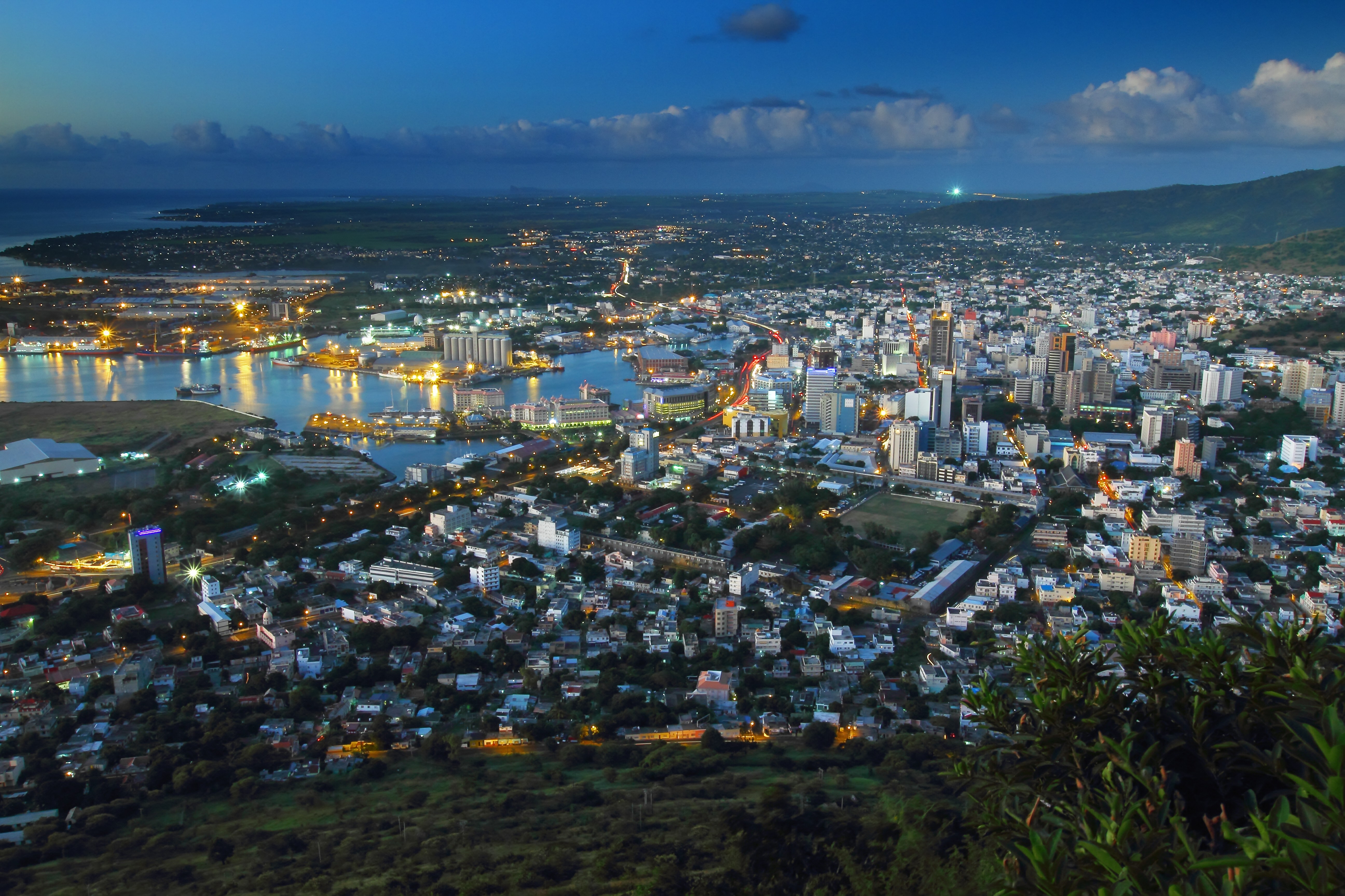 a view of a city with a large body of water in the background