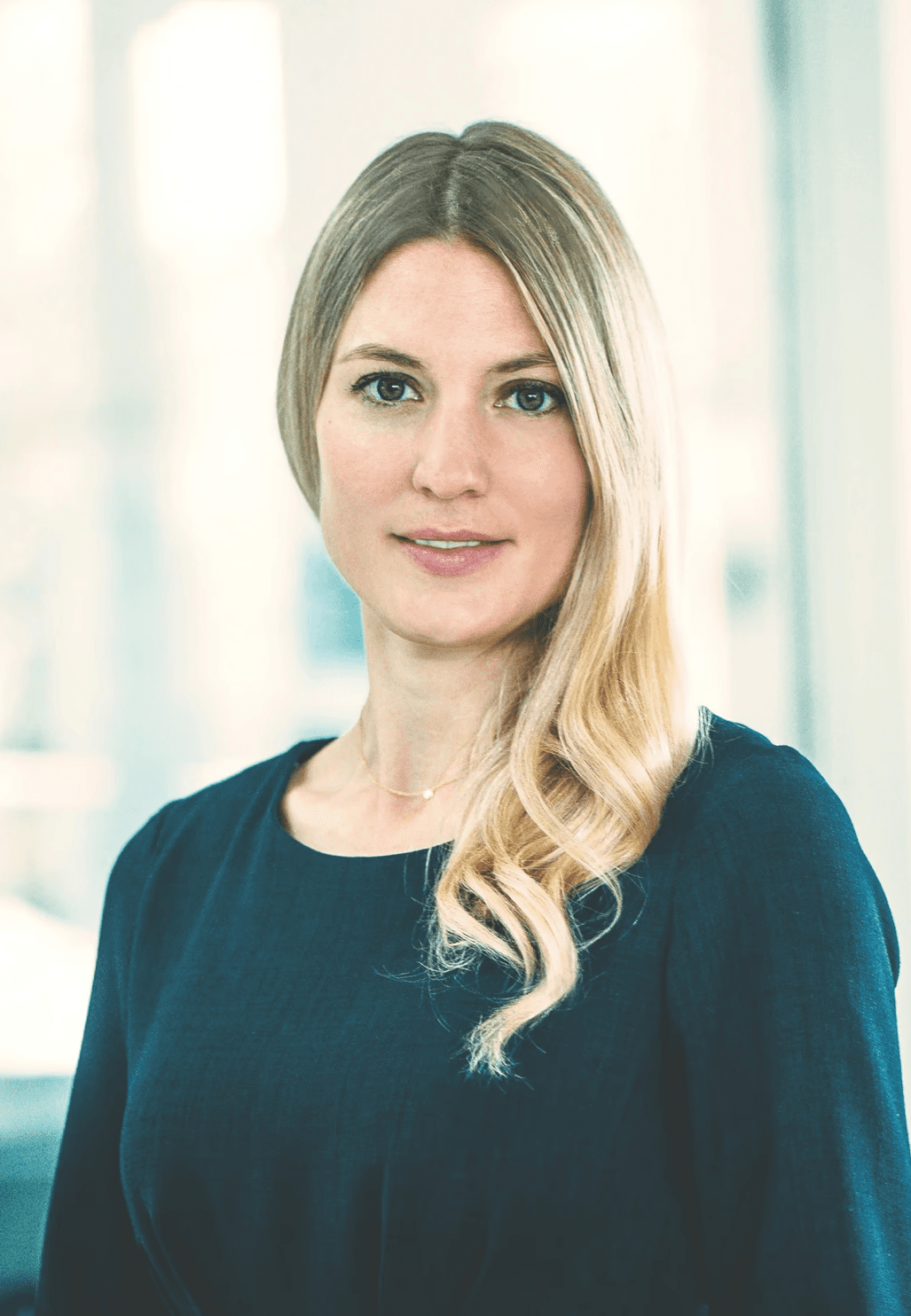 woman in red cardigan smiling