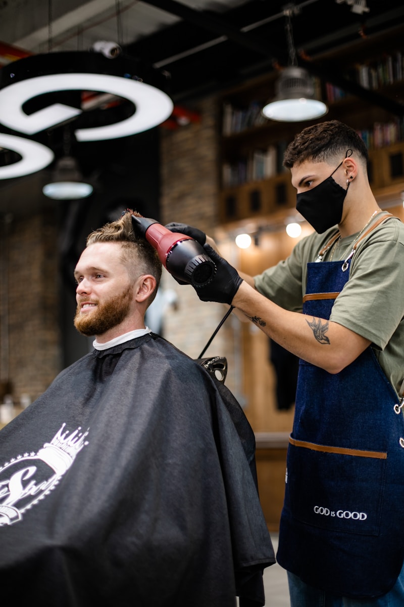 a man with a beard and a hair clipper on his head
