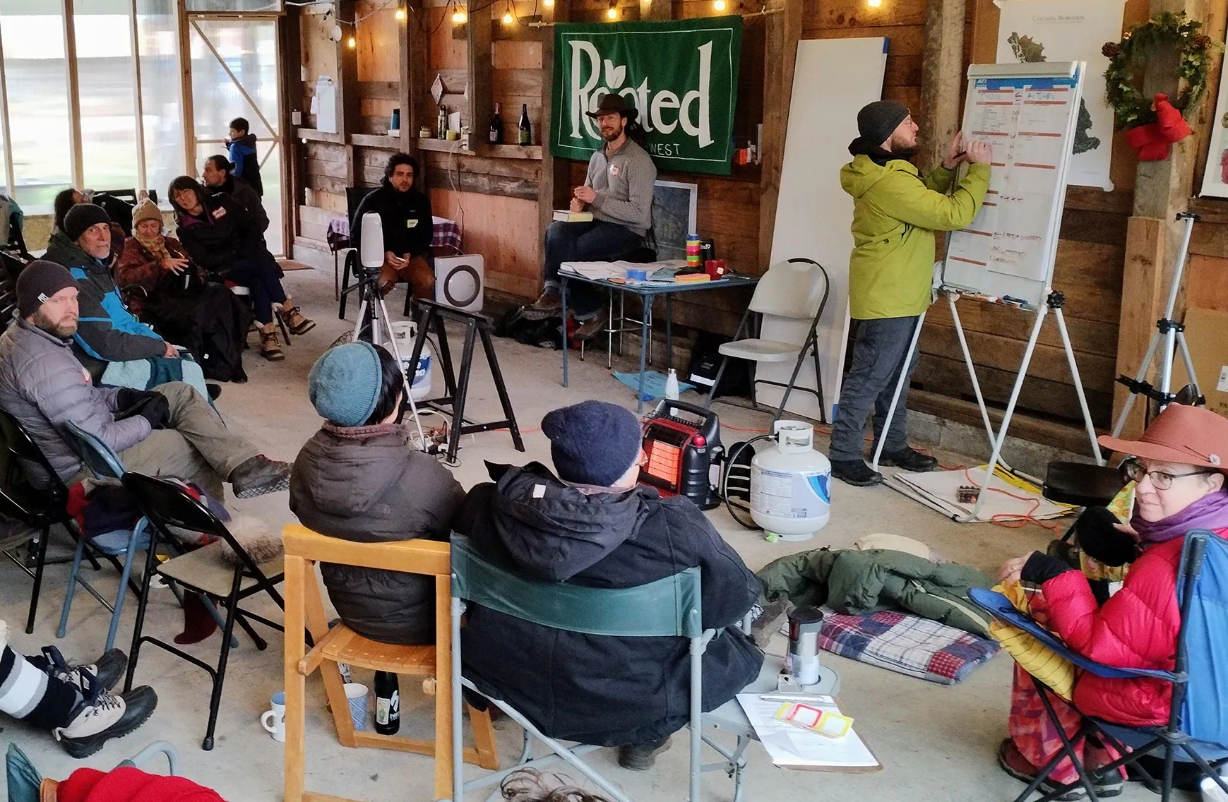 Community members participating in a group meeting and discussion indoors.