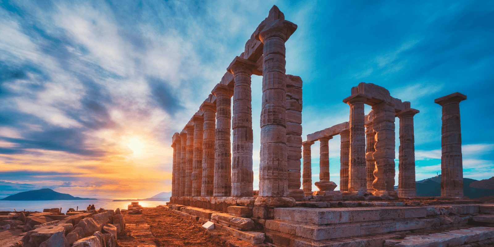 Sunset over ancient ruins, symbolizing the rediscovery of forgotten histories like Alice Lavender Lee's legacy.
