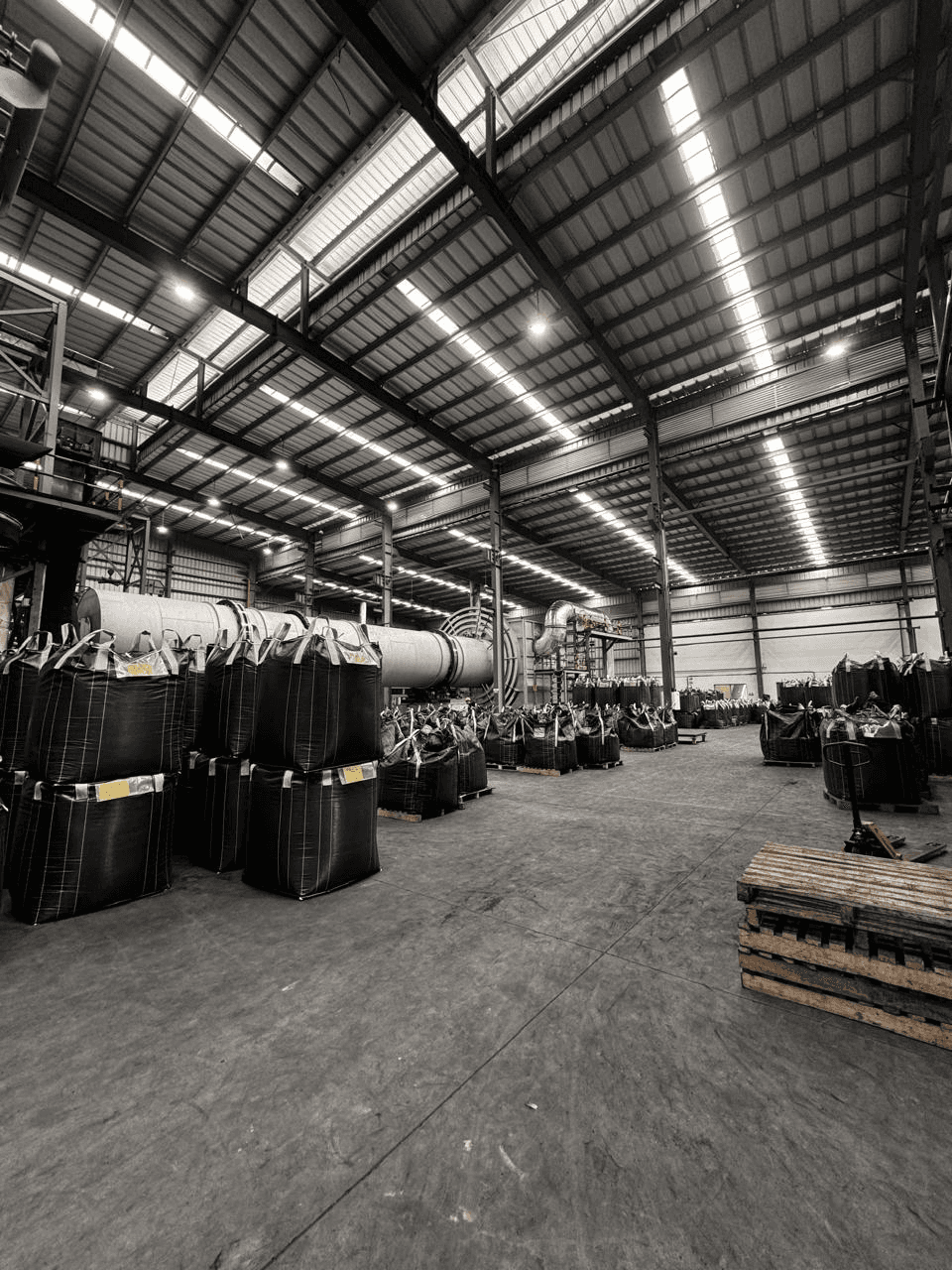 Advanced production infrastructure at the IVAR Carbons manufacturing facility for high-capacity coconut shell activated carbon processing.