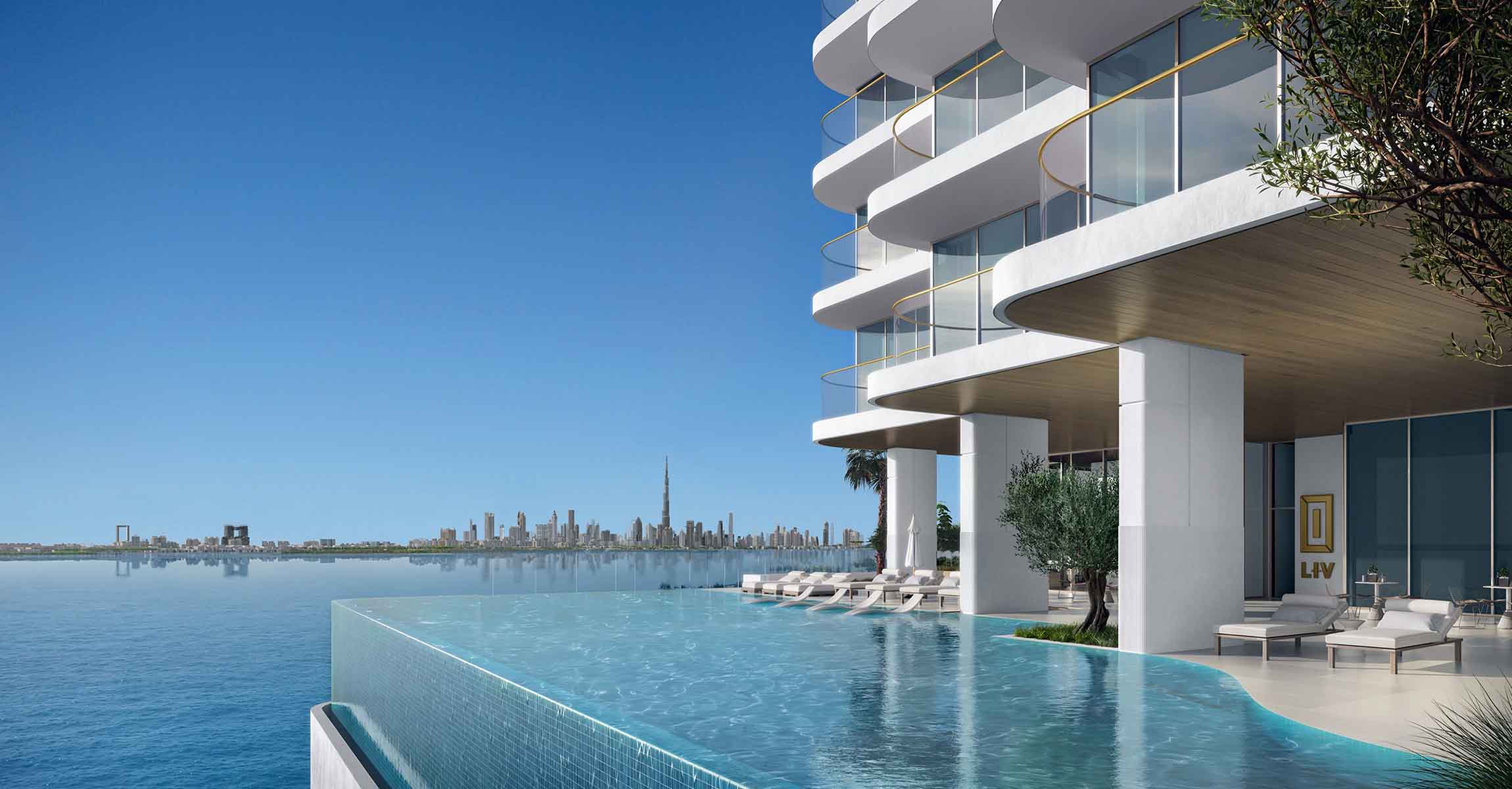 Overhead perspective of LIV Oceanside, featuring a contemporary building and a spacious pool area.
