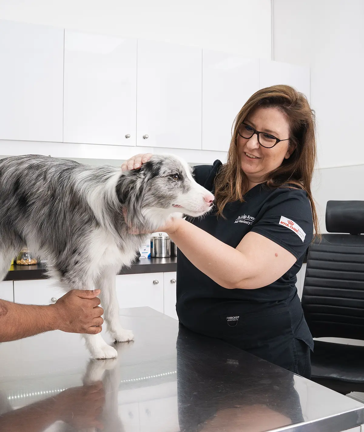 Dr. Mafalda Sardinha and Yana with a Saluki dog at Noble Vet Clinic in Dubai.