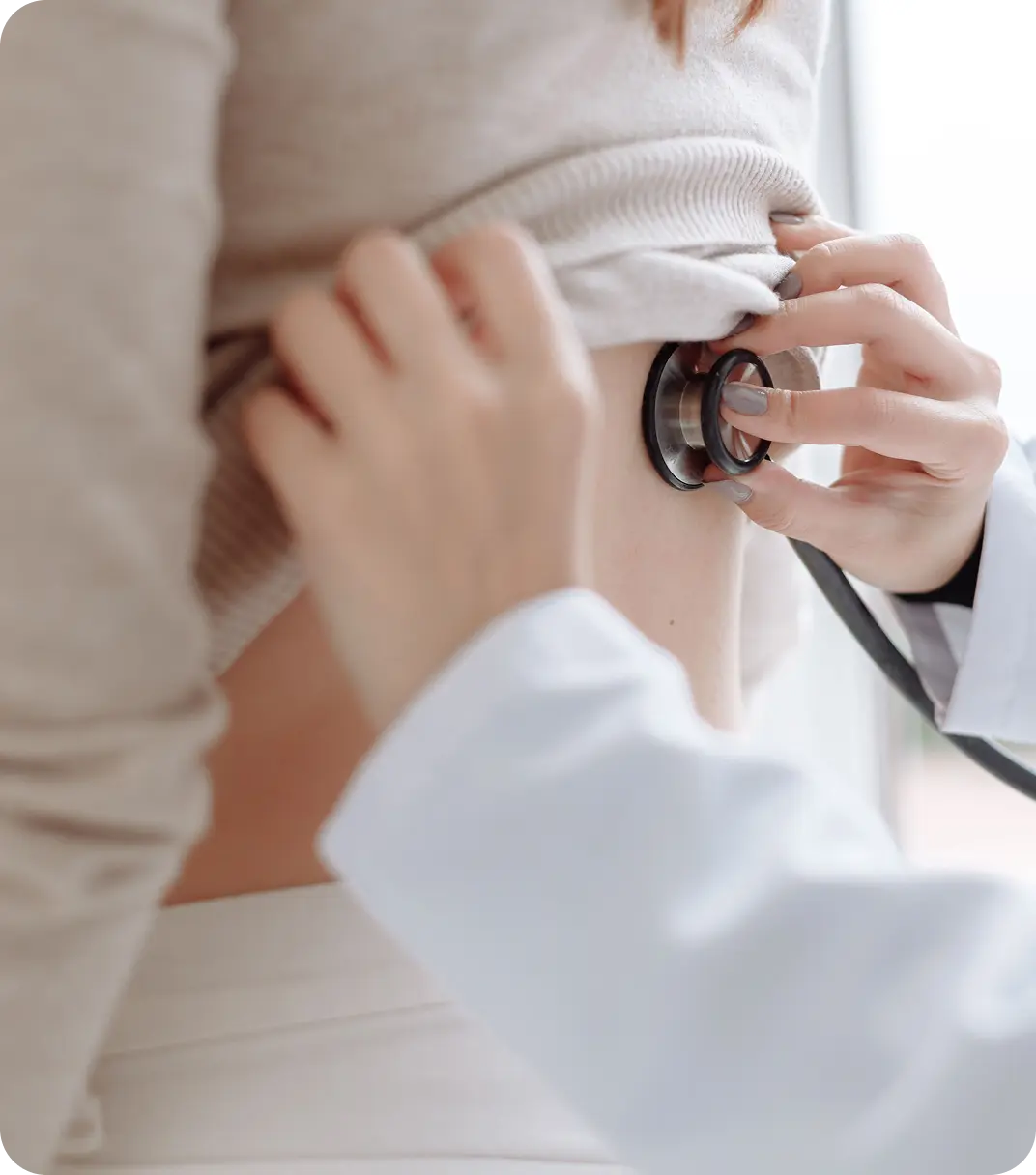 Healthcare professional performing a routine medical check-up on an elderly resident.