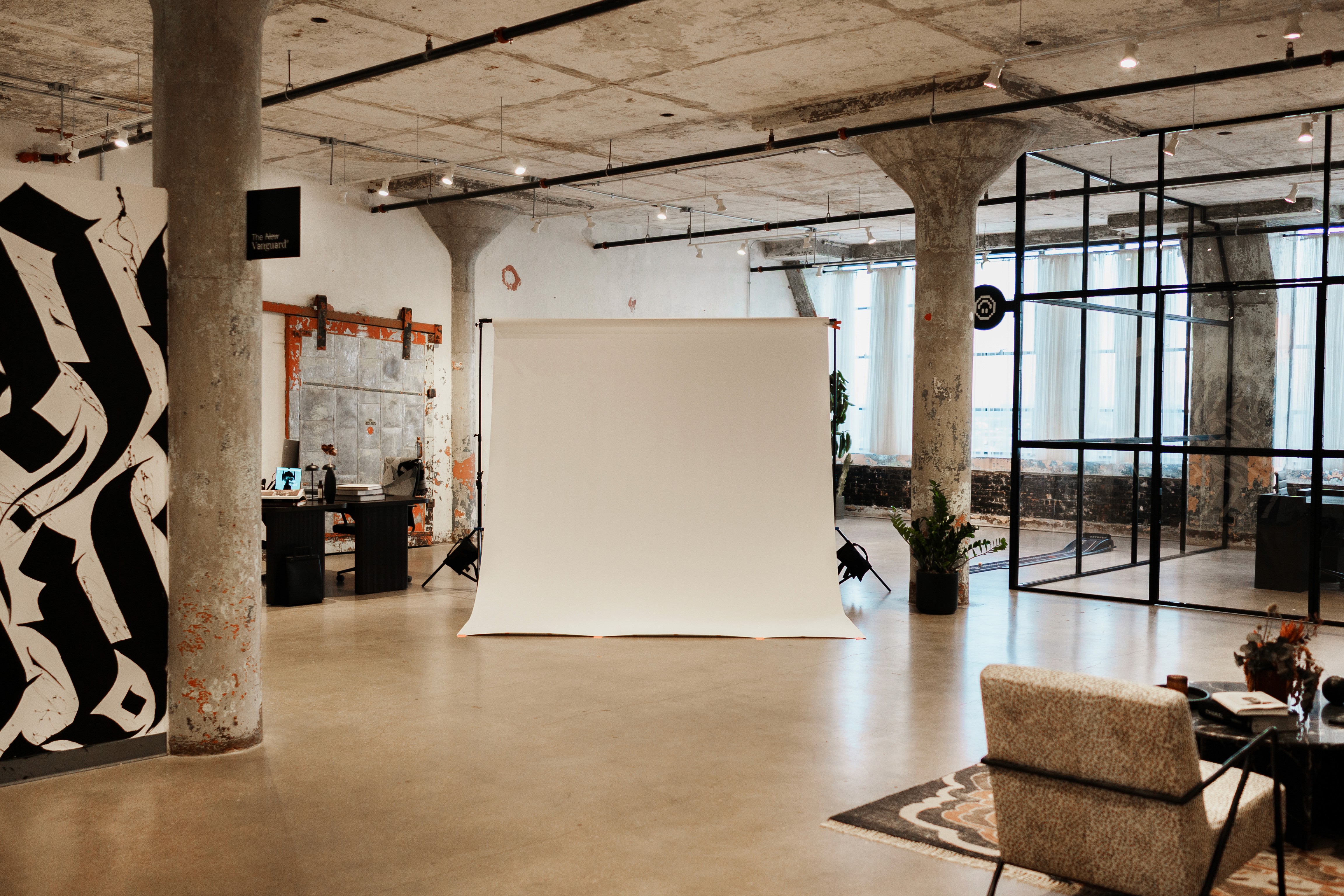 Wide shot of studio with white backdrop in the center 
