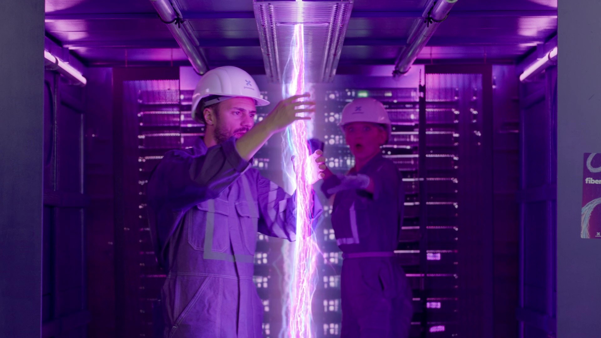 Two technicians about to touch fiber energy