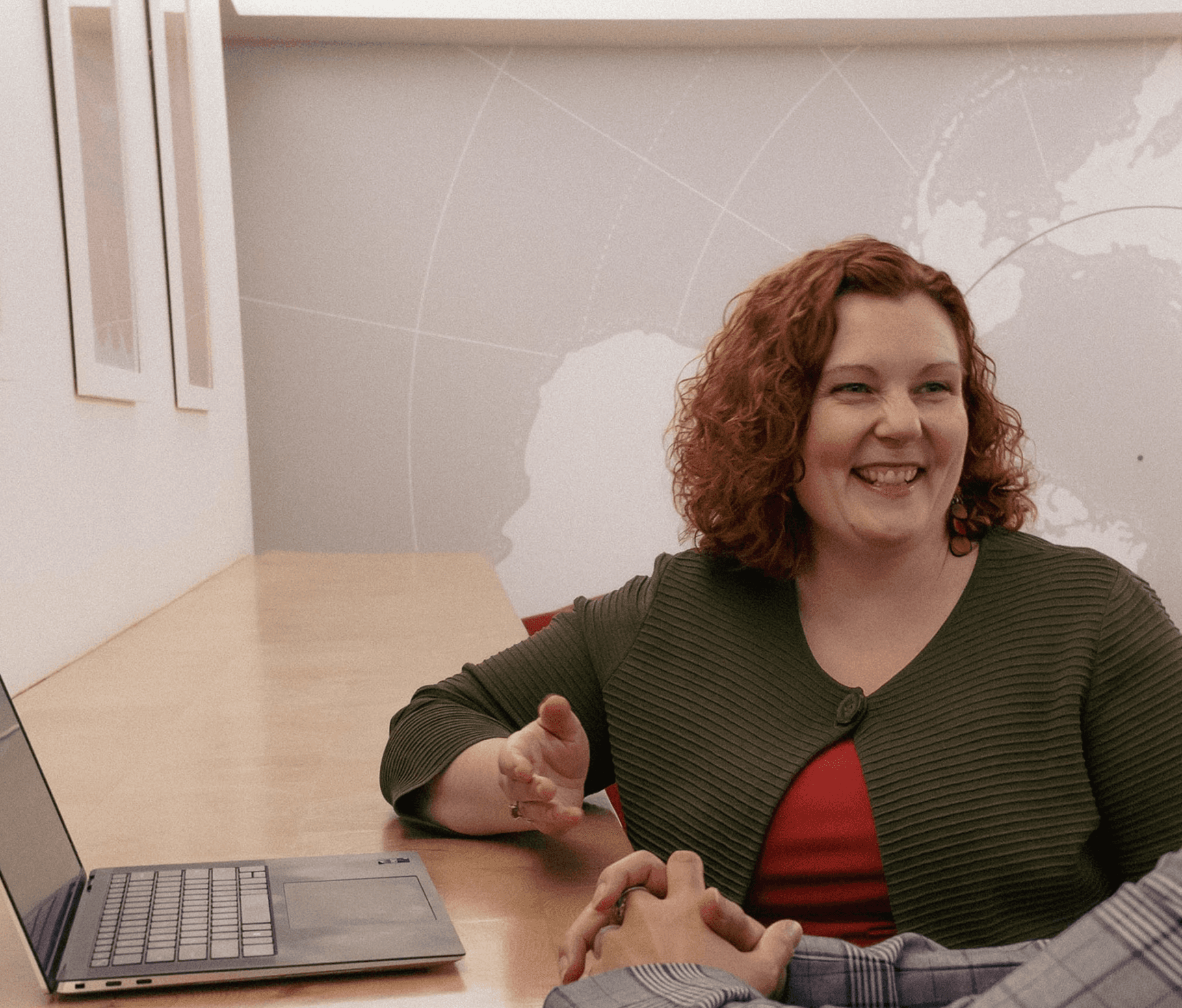 Cara Fox, ZenFox Solutions founder, seated and smiling during a leadership coaching conversation.