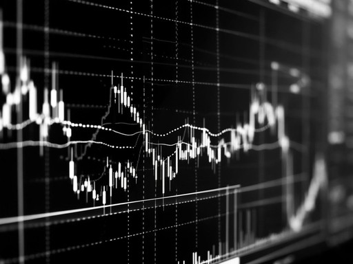 Close-up of fluctuating financial chart on a screen, symbolizing contract performance data