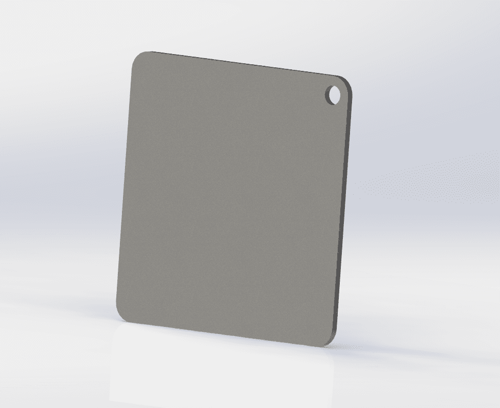 Square pizza baking steel with a thumb hole, used as a case study for reducing production costs through optimized product design.
