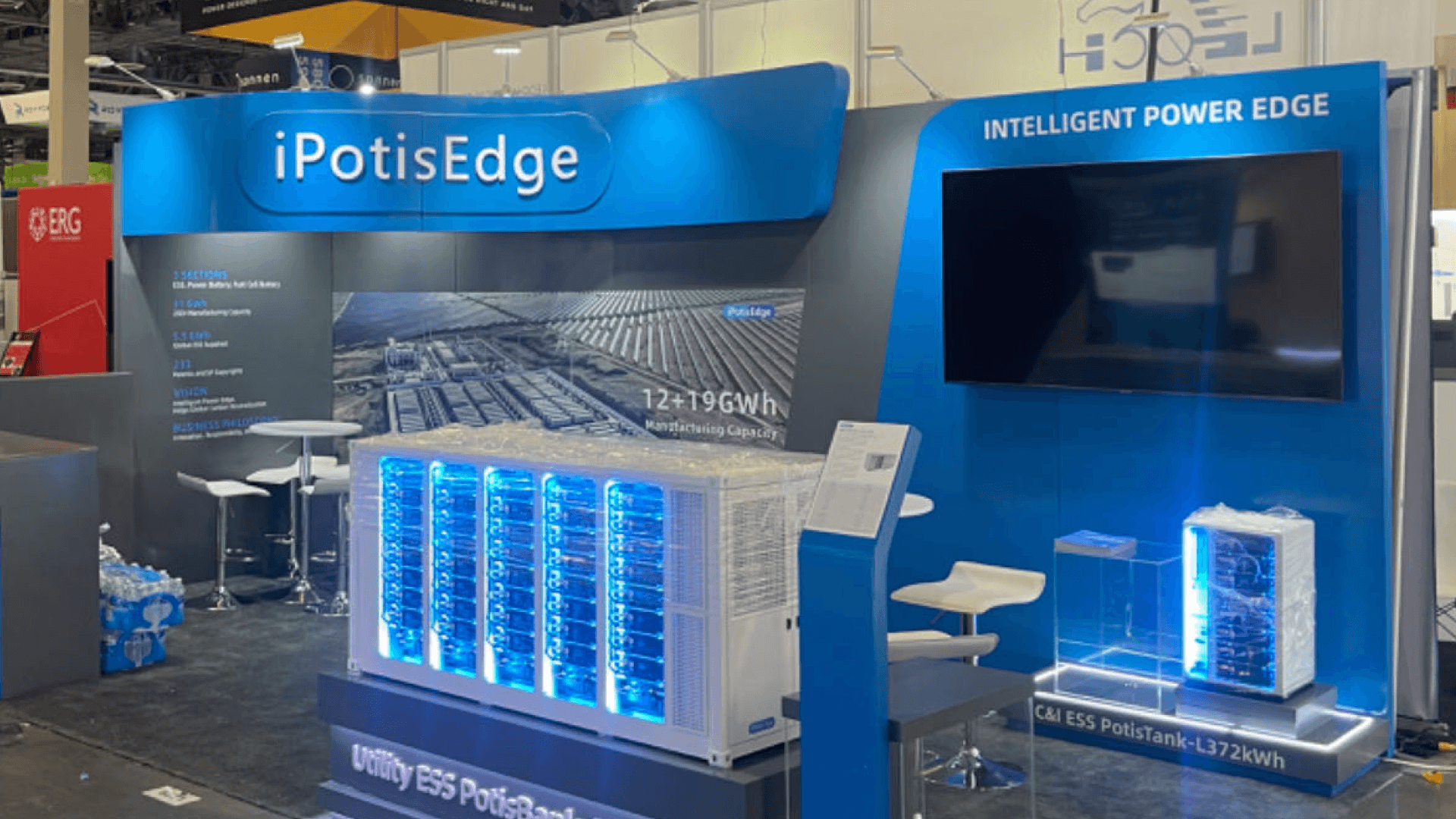 IpstisEdge RE+ 2023 10x20 booth close-up in Las Vegas showing illuminated ESS battery model, intelligent power edge wall, and product explanation area