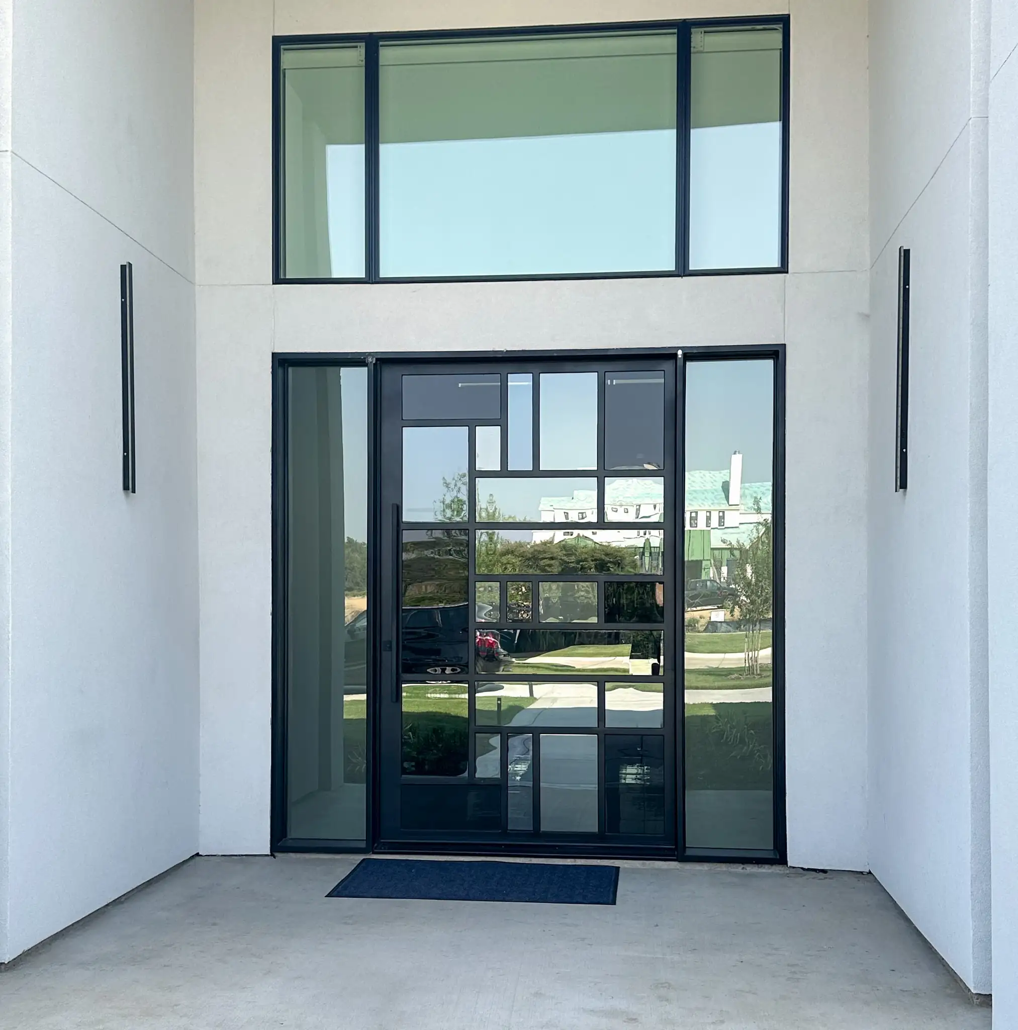 Mondrian style iron door installed on a Southlake home by M2 Metals Iron Doors DFW