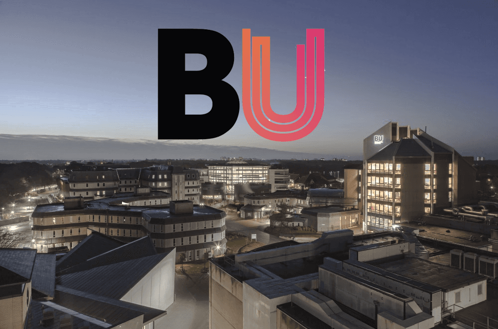 Bournemouth university logo at campus overview at night