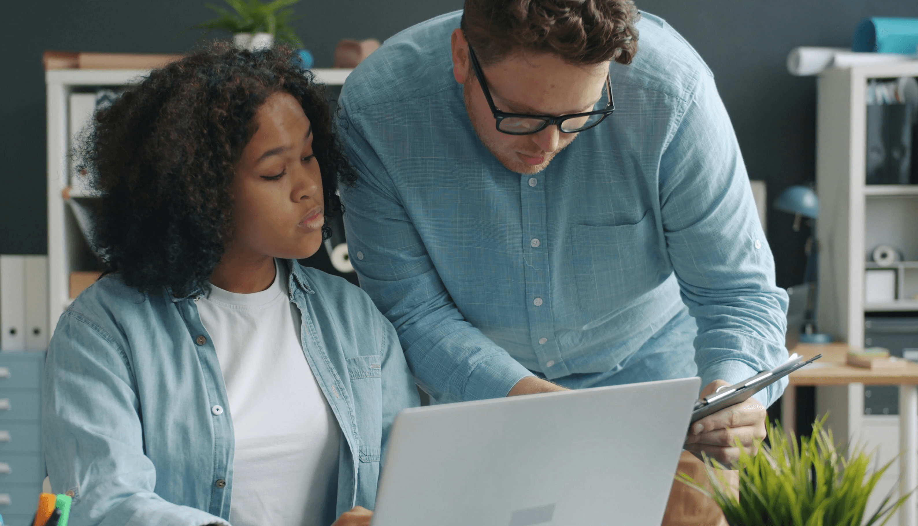 young couple looking at computer