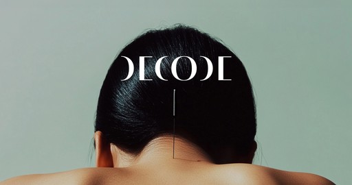 Airplane wing seen through a window above clouds