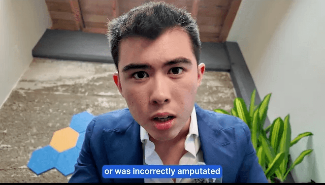 Red monster truck jumps over dirt mound