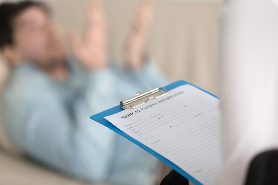 A doctor discussing his reports with patients.