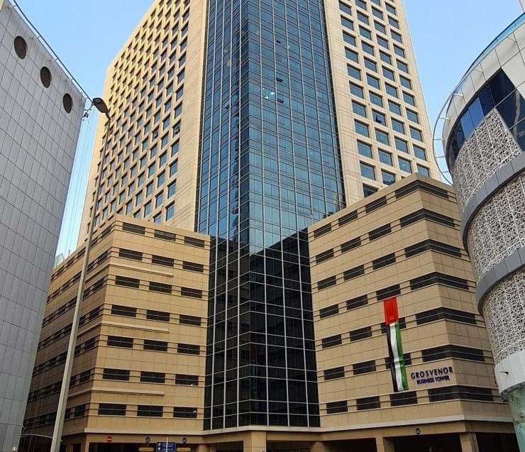 Street-level view of the Grosvenor Business Tower entrance, featuring easy access for corporate clients and guests.