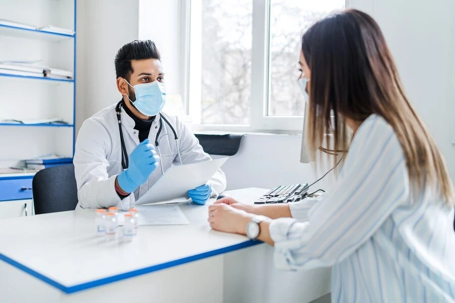 physician and patient discussing about medication and procedure