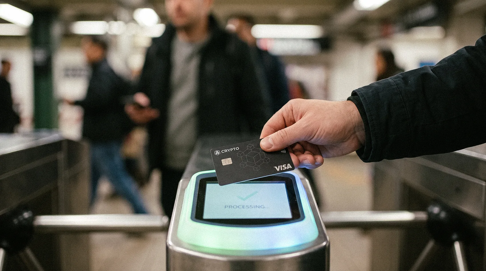 Hand tapping black Crypto Visa card on subway turnstile processing screen - Mastercard crypto cards digital transactions