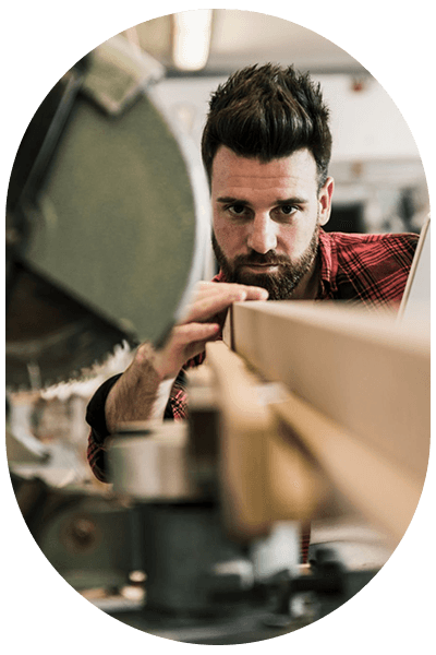 Carpenter inspecting timber