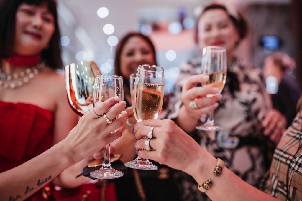 Guests cheering champagne glasses