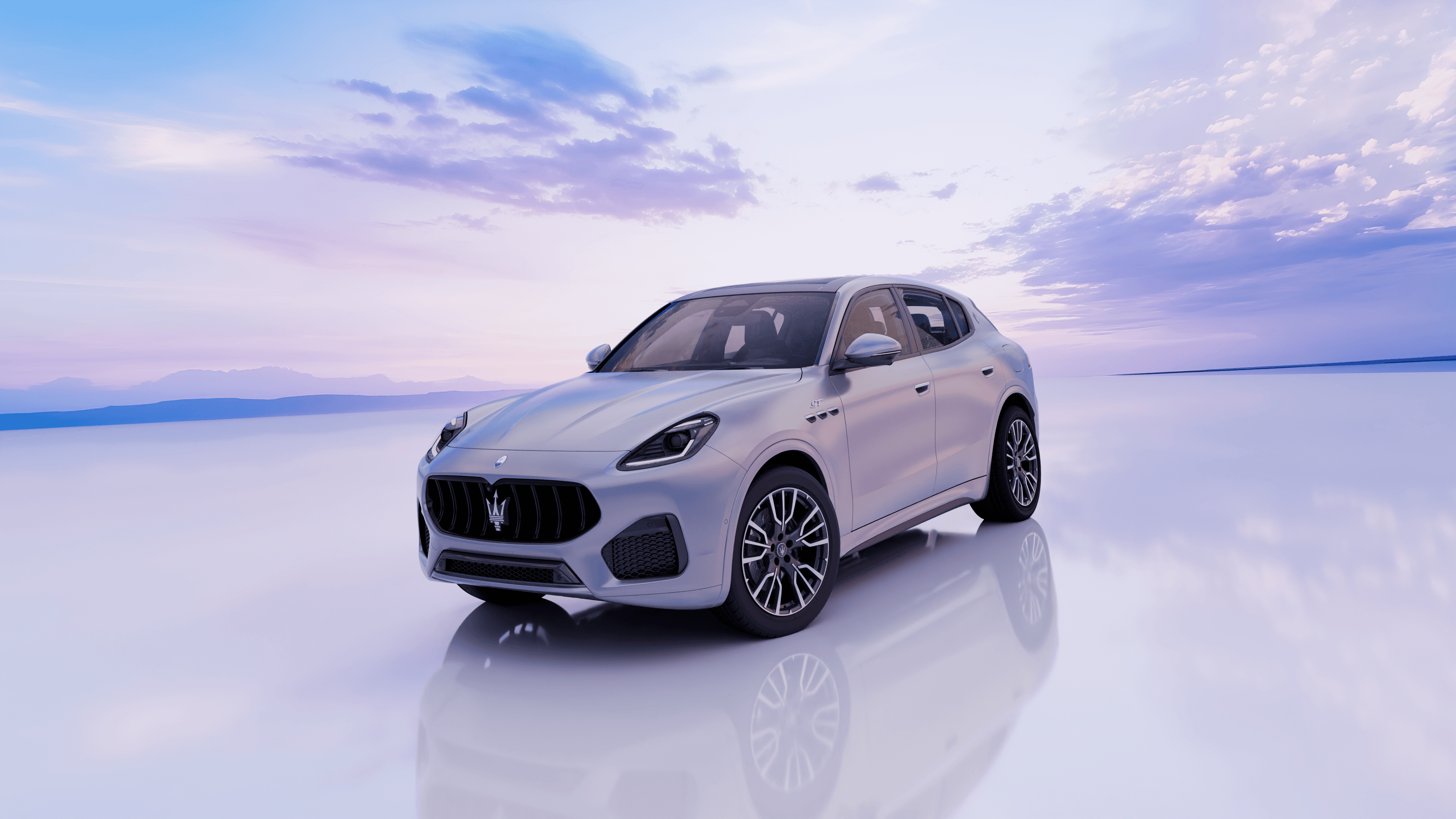 Voiture Maserati Grecale avec une prise de vue dynamique dans un environnement coloré.