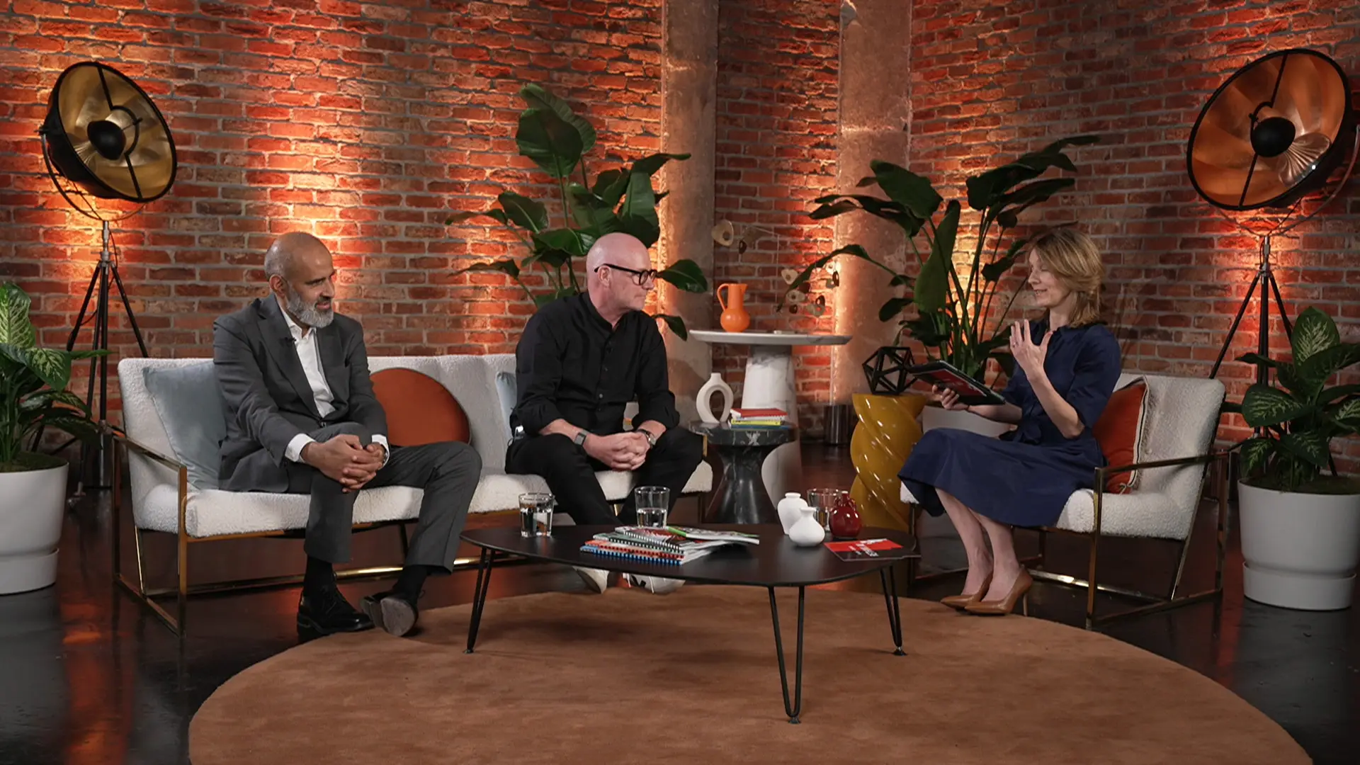 Multi-speaker panel discussion filmed in a styled studio set with soft furnishings, plants and broadcast lighting for Wired x Kyndryl.