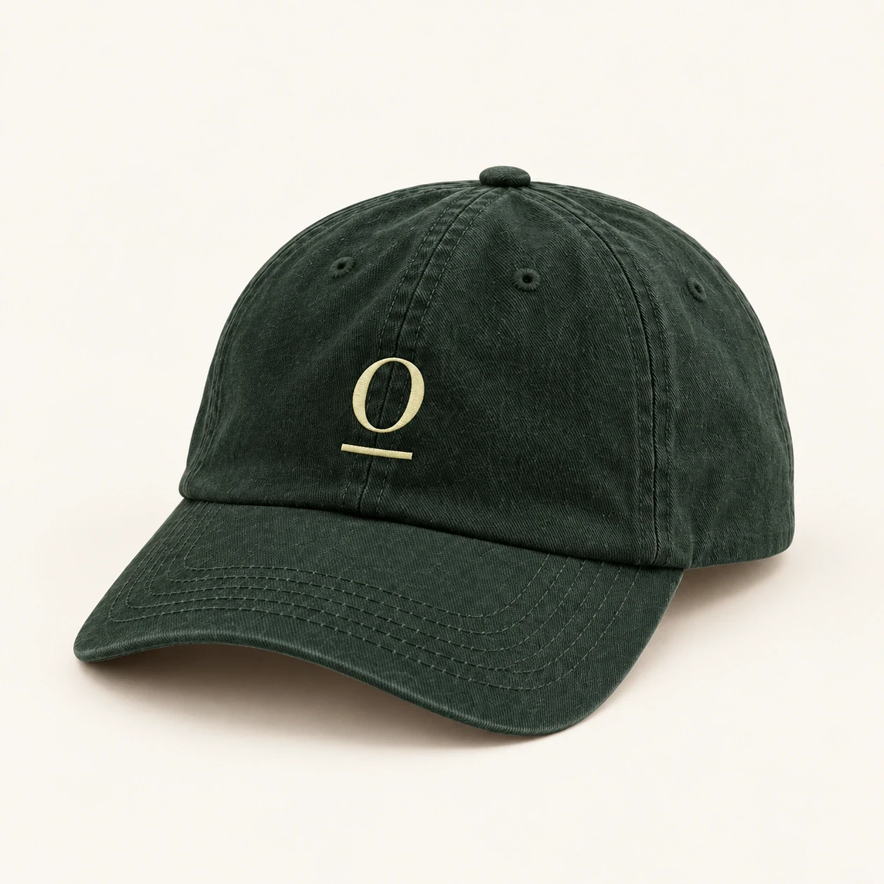 Forest green baseball cap with a citron underlined O.
