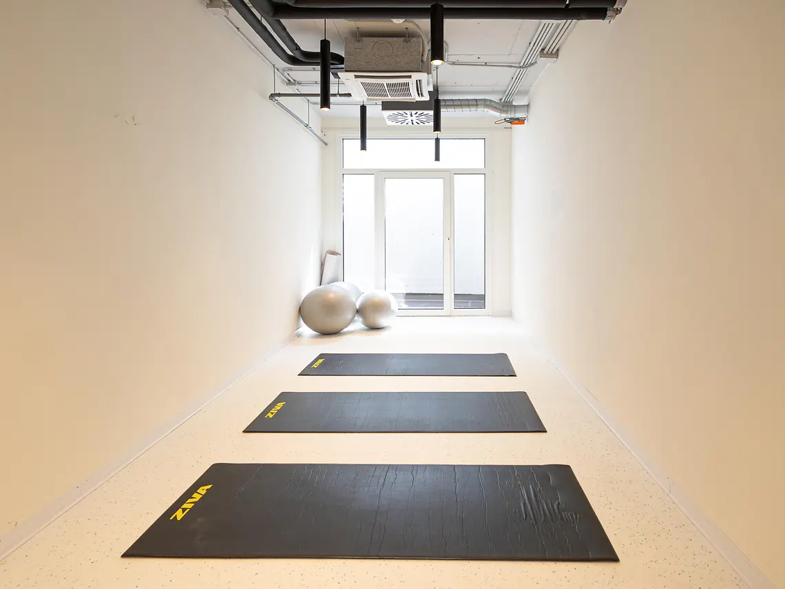 Yoga studio with mats and exercise balls at a student accommodation in Bologna