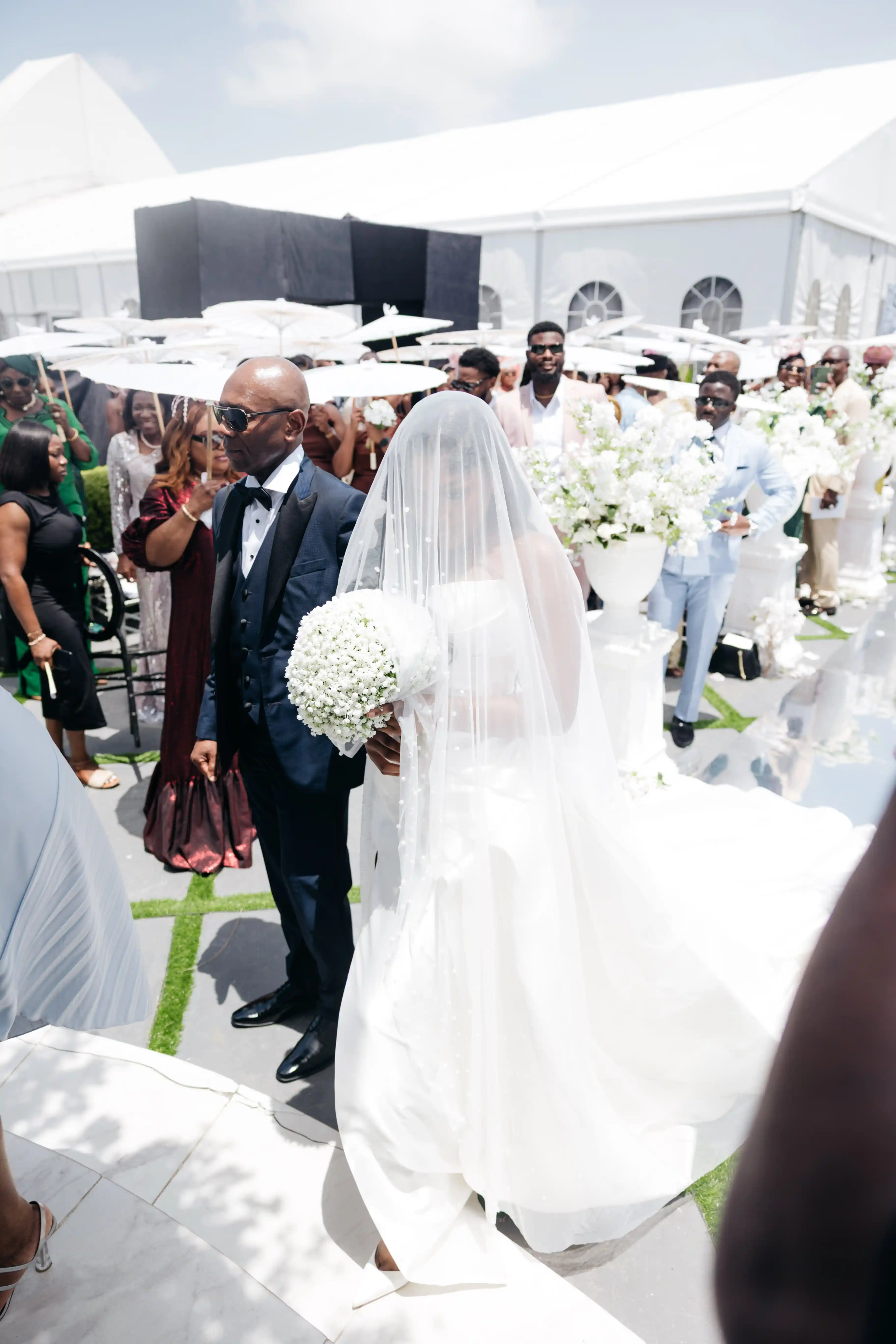 Bride and groom celebrating a luxury wedding coordinated by Victoria Brooks Events, a premium wedding planner in Nigeria.