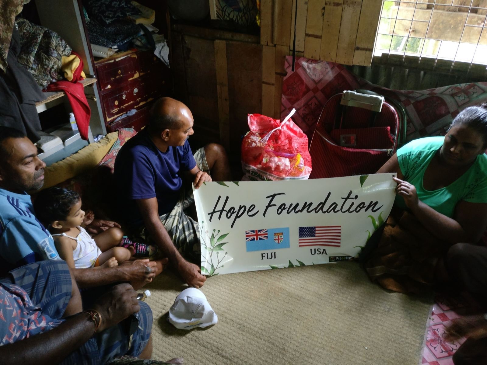 a group of children sitting on steps in front of a building