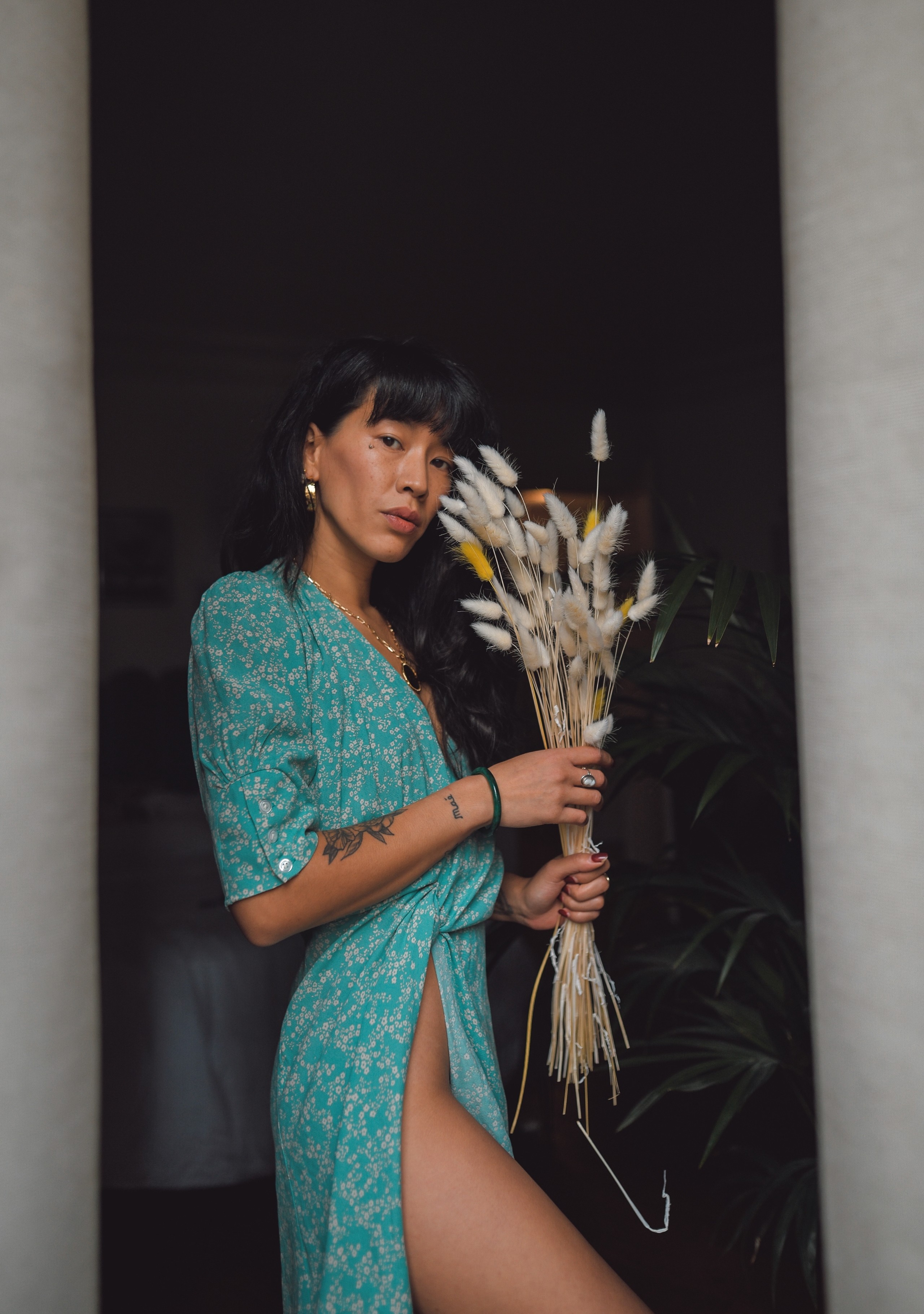 dressing leello with dry flower in her hands