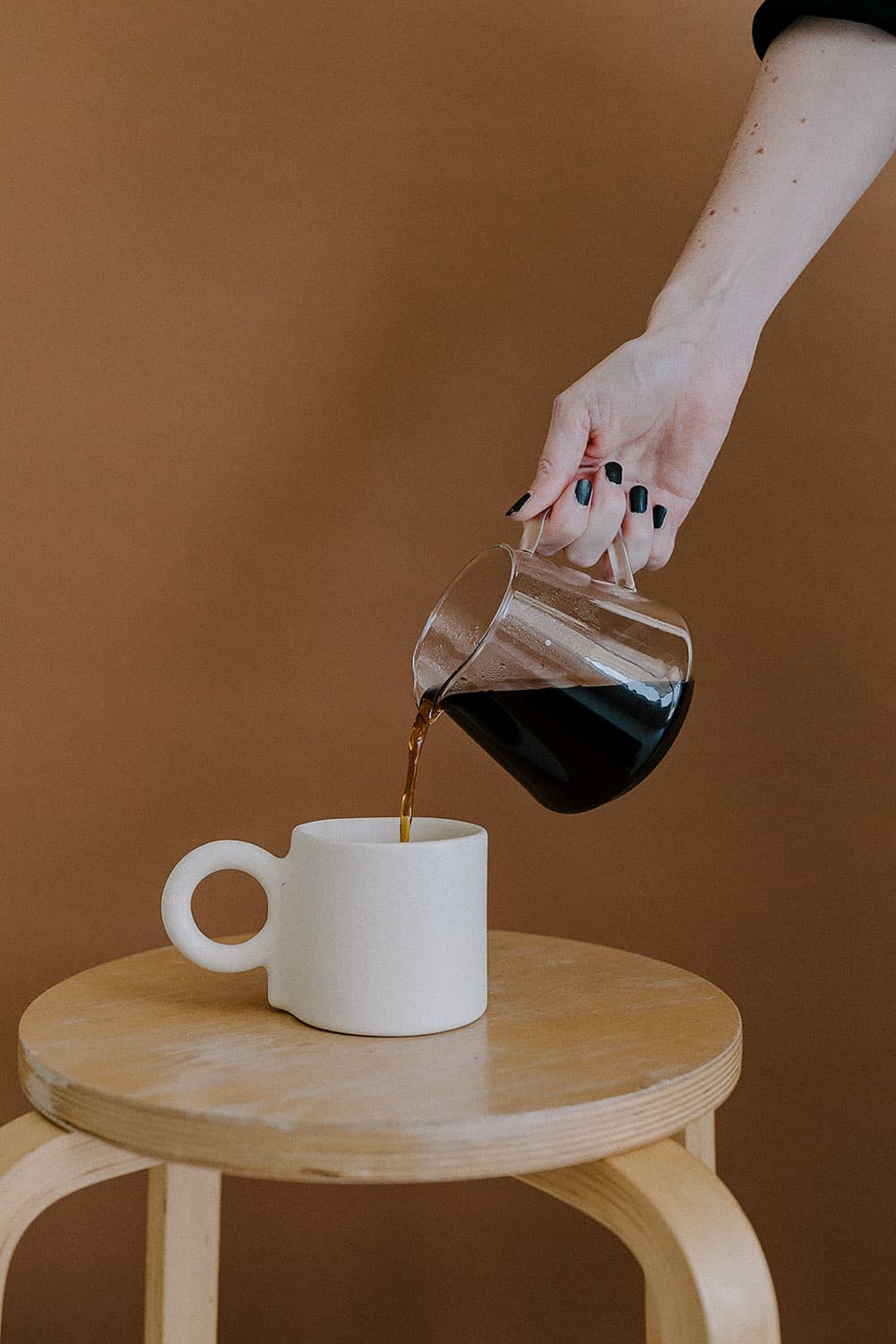 Pouring coffee into cup