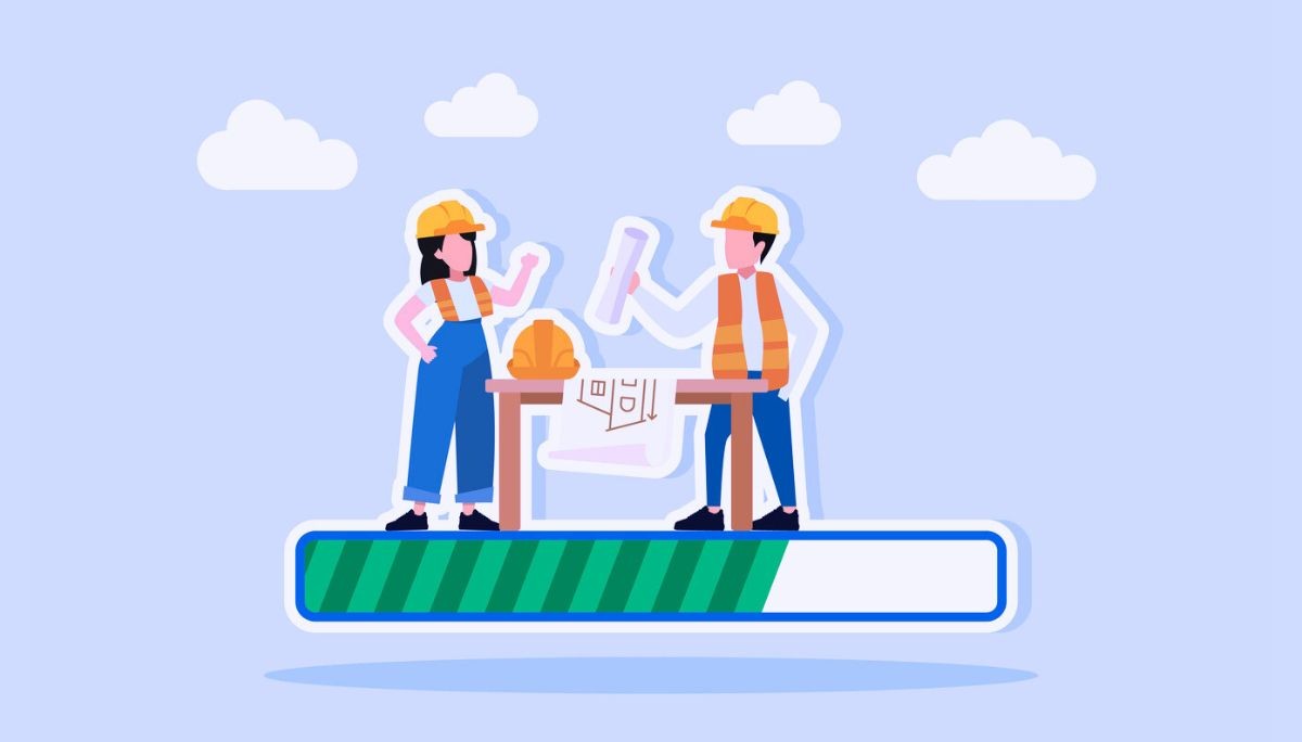 Illustration of two construction workers standing on a progress bar, wearing hard hats and safety vests, reviewing blueprints on a table between them.