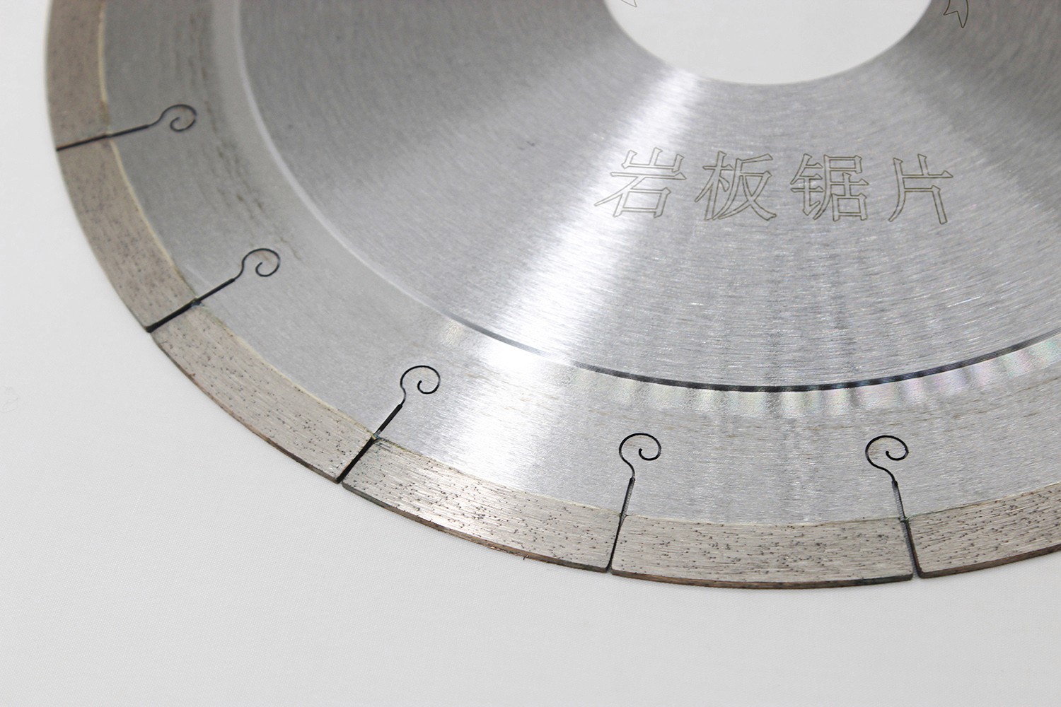 Angled close-up of the segmented teeth on a Diamond Saw Blade For Dekton, demonstrating the precise engineering.