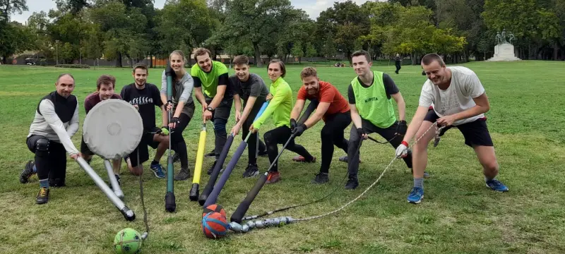 person sitting on grass and using phone